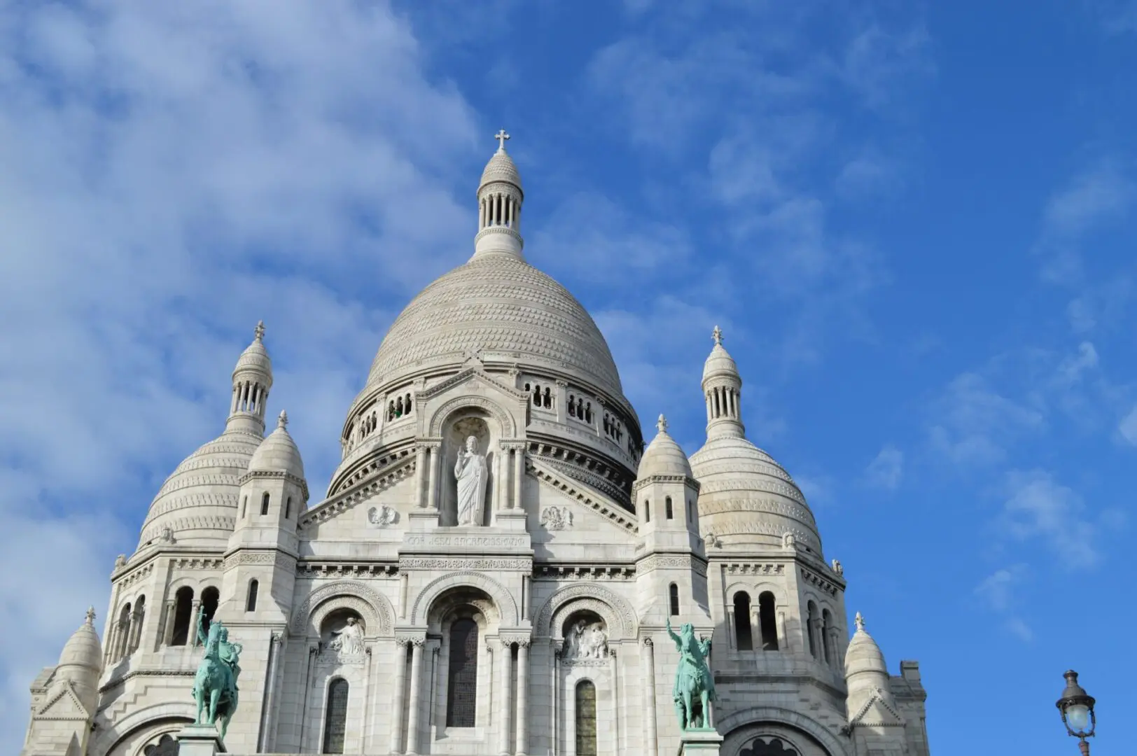 A large building with many domes and statues on it