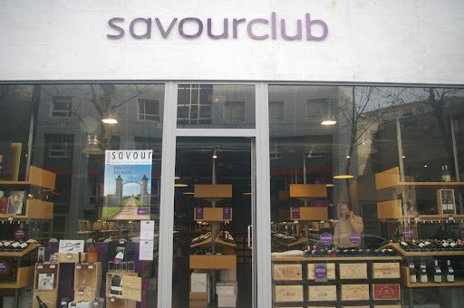 A store front of savourclub in the city.