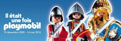 A couple of playmobil figures are standing up